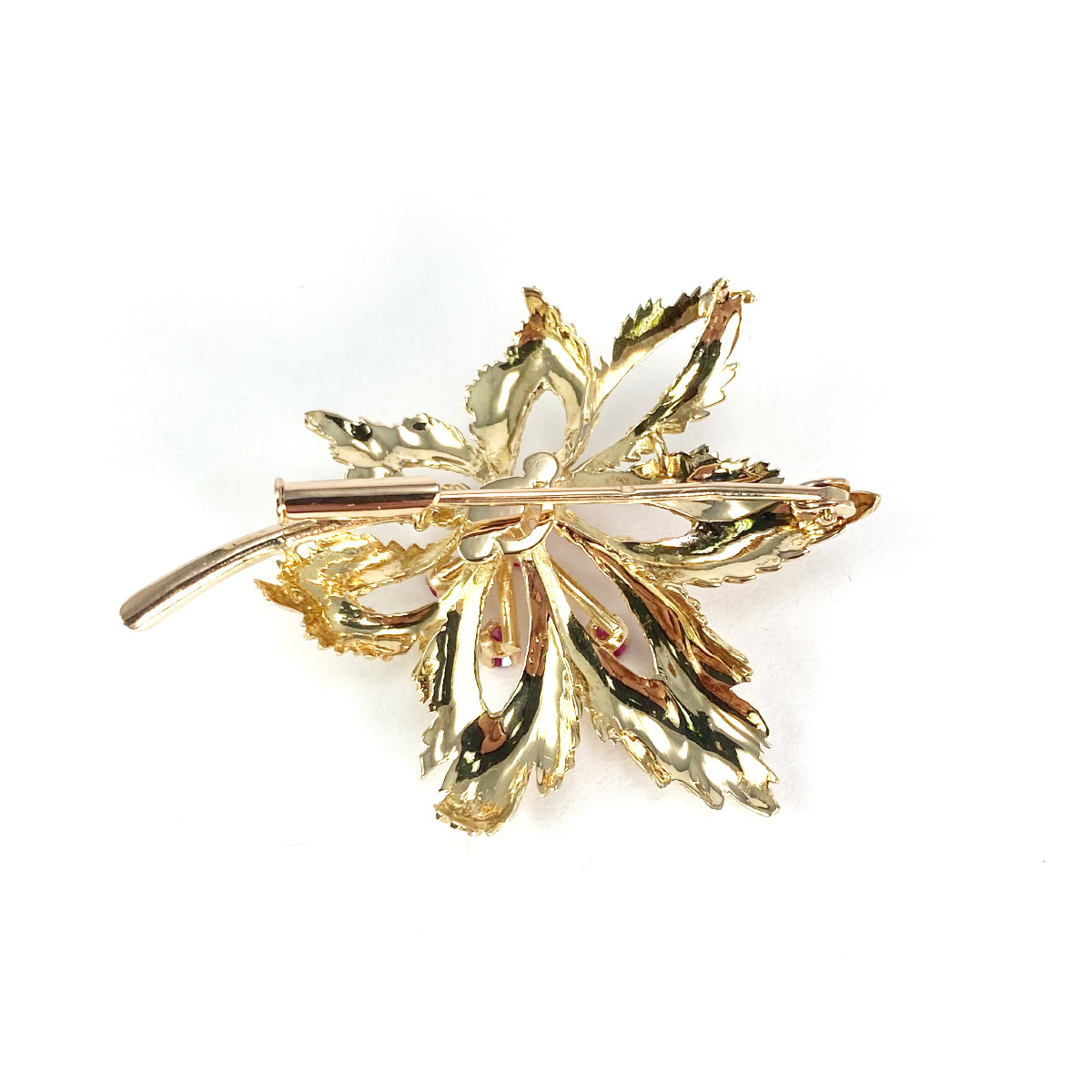 Broche d'occasion or 750 jaune rubis synthétiques