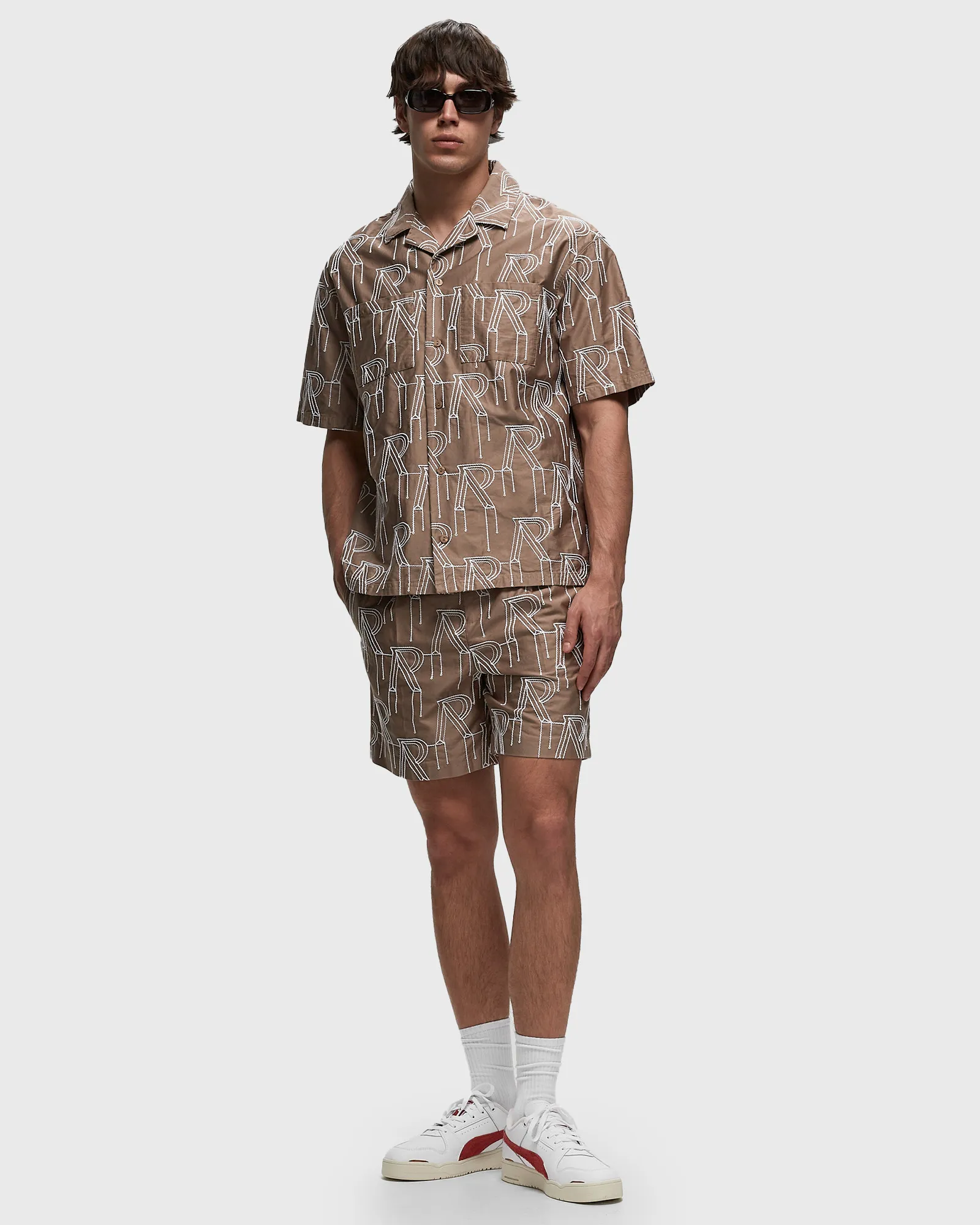 Represent EMBRODIERED INITIAL TAILORED SHORT