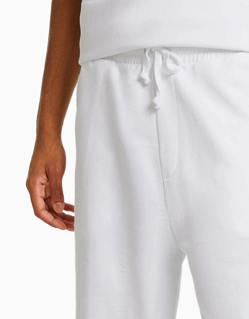 Bermudas de pelúcia com efeito desbotado