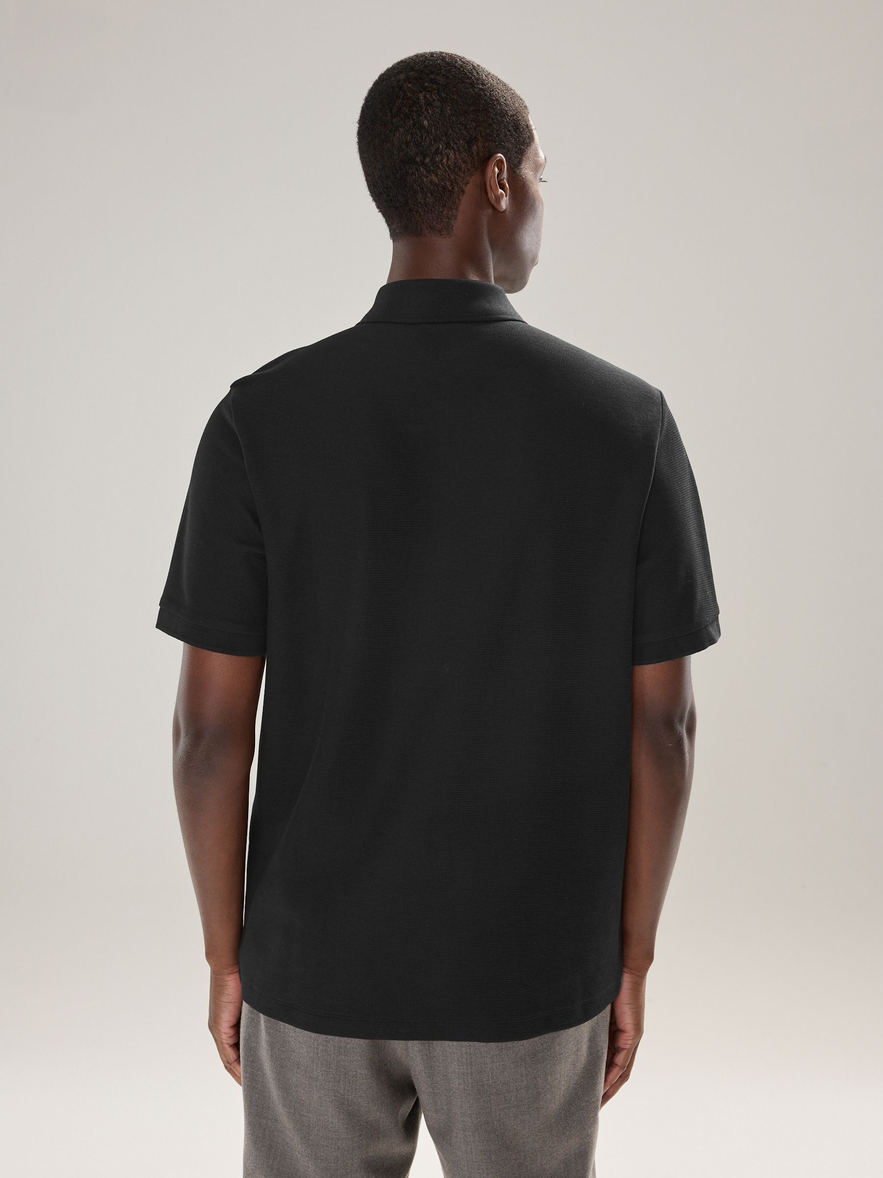 Zwart - Smart poloshirt met textuur en rits