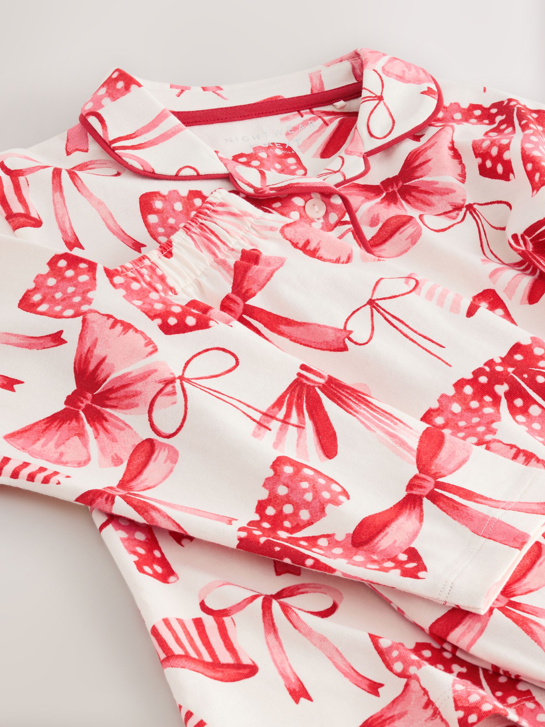 Rode/witte strik print - Pyjama met knoopsluiting (3-16jr)