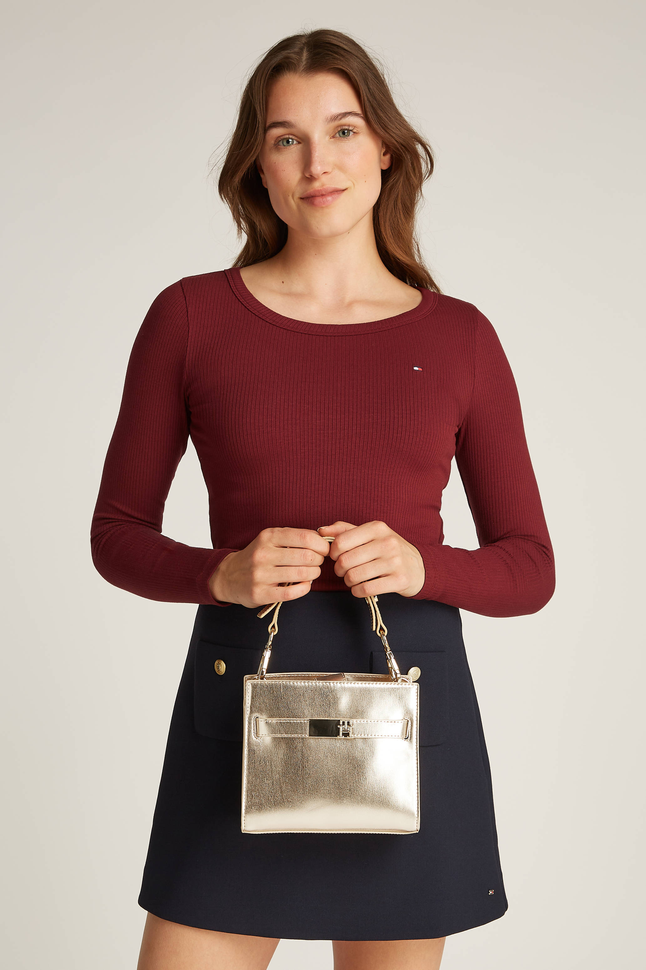 Tommy Hilfiger mini handtas TH Heritage goudkleurig