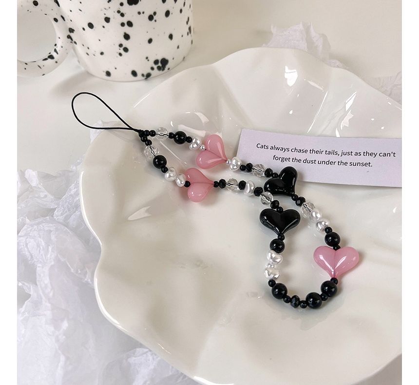 Karnemelk - Hartvormige kralenketting met zwart-roze decoratie voor telefoon