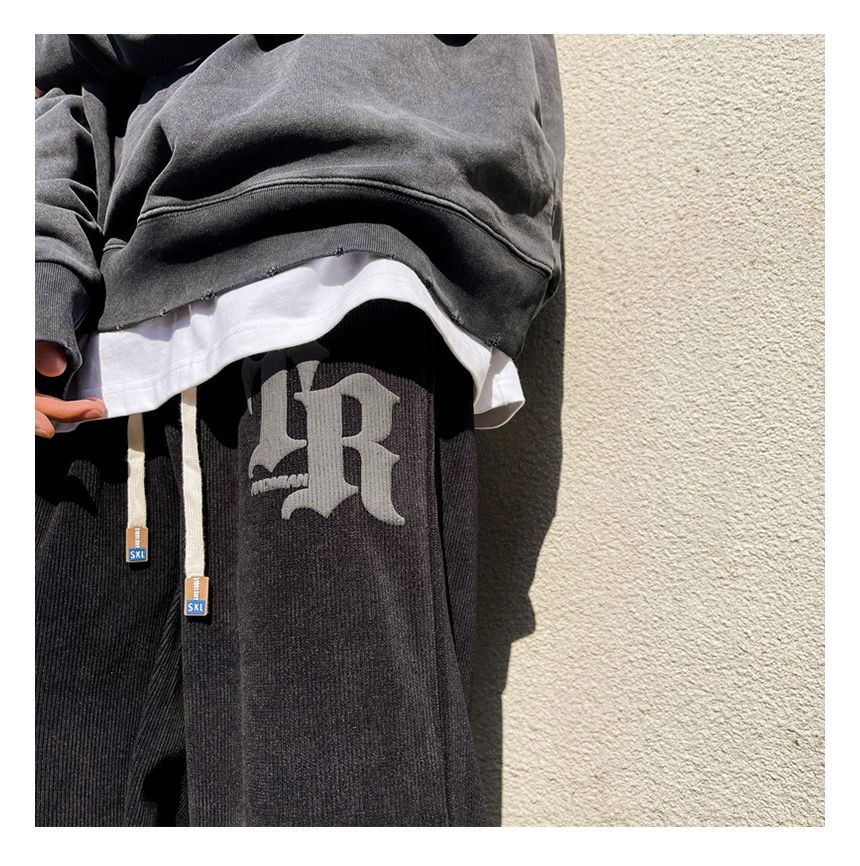 FOEV - Joggingbroek met trekkoord en letters