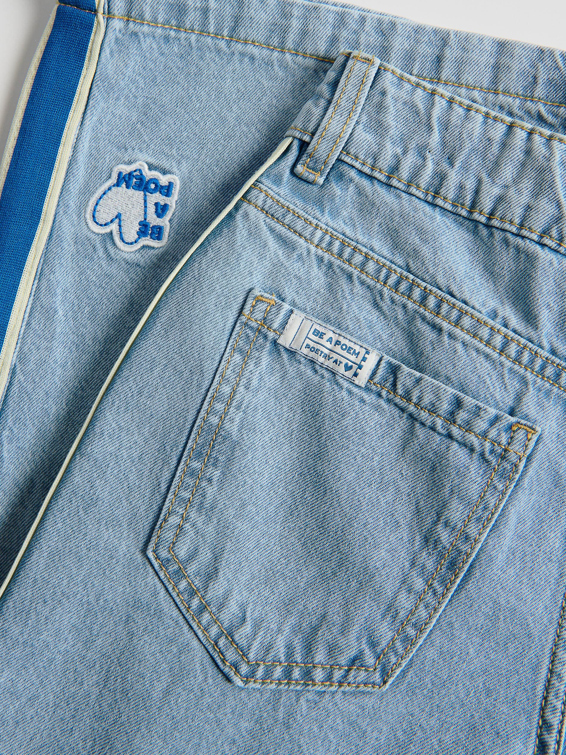 Superweite Jeans mit Seitenstreifen