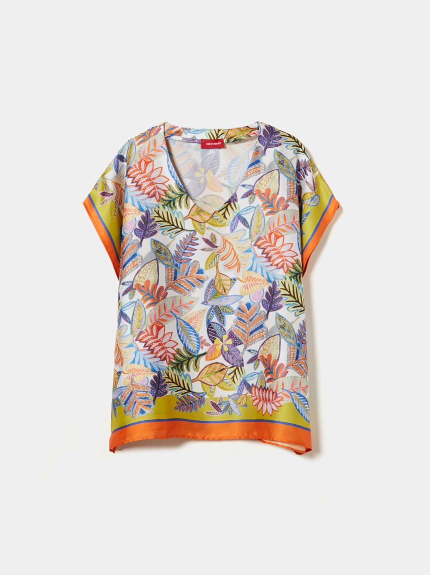 Blusa estilo poncho com padrão tropical
