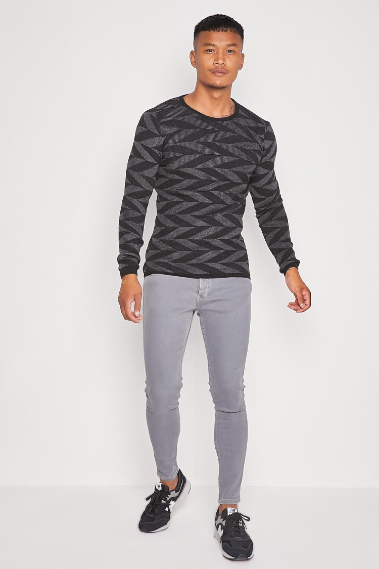Pull noir/gris foncé avec imprimé géométrique