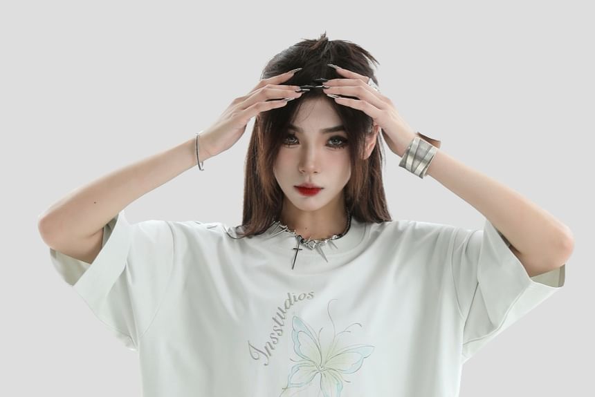 Banash - Oversized T-shirt met korte mouwen, ronde hals en vlinderprint