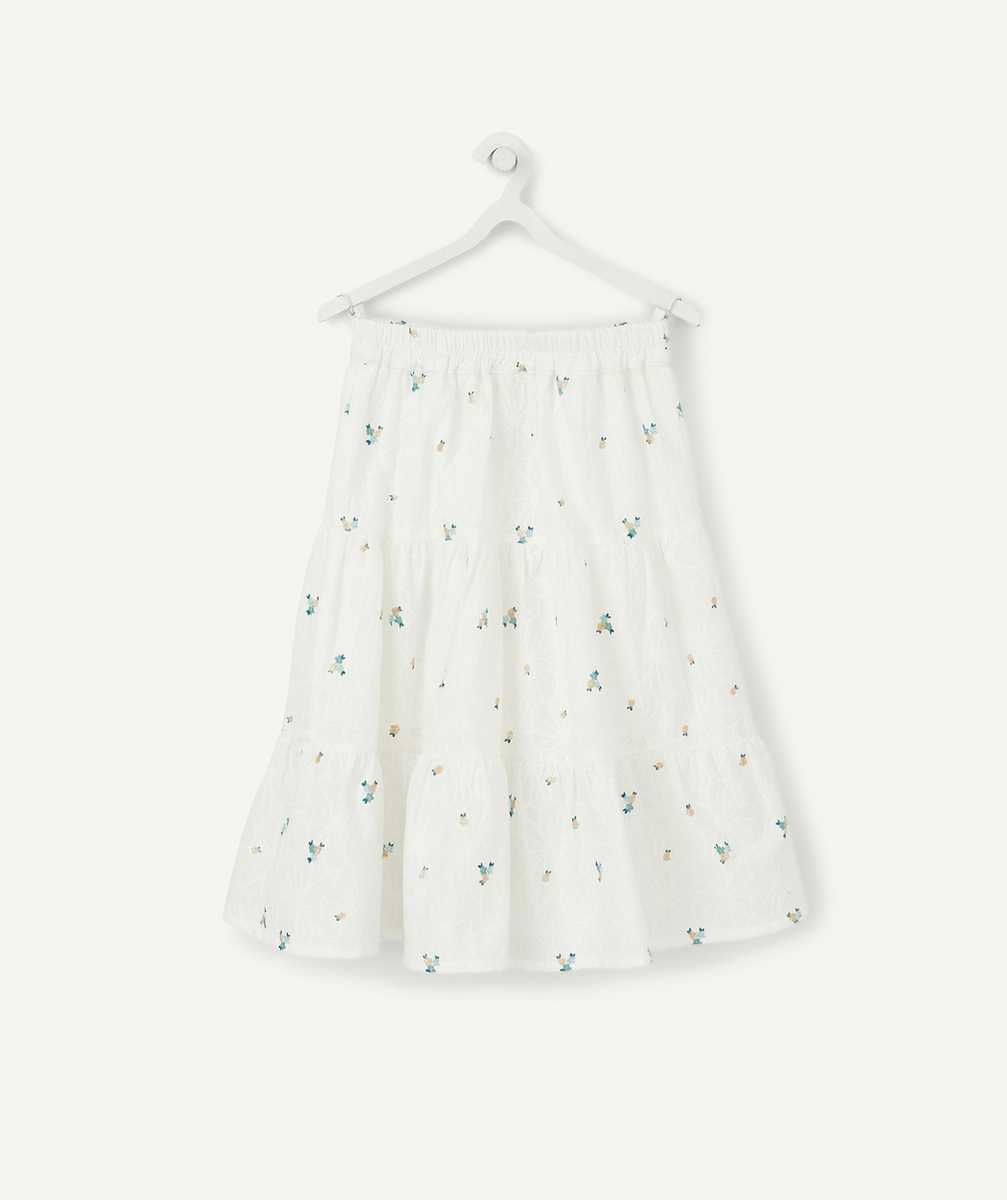 LA JUPE LONGUE BLANCHE EN COTON AVEC FLEURS ET DÉTAILS COULEUR DORÉE