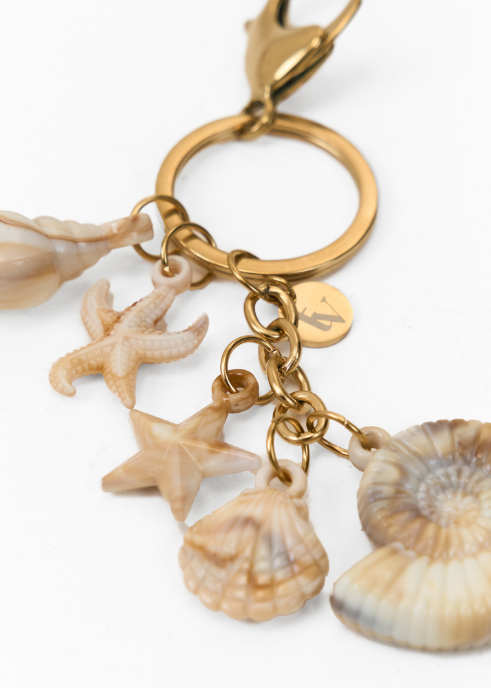 Romy bag charm creme
