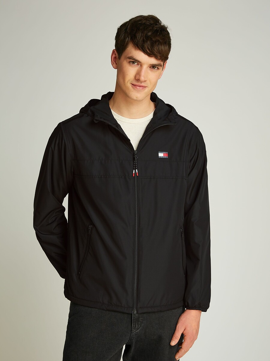 TOMMY JEANS<br>Jaqueta leve com zíper e capuz