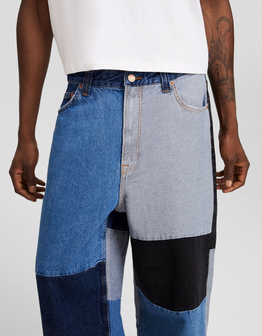 calças jeans super largas com blocos de cores