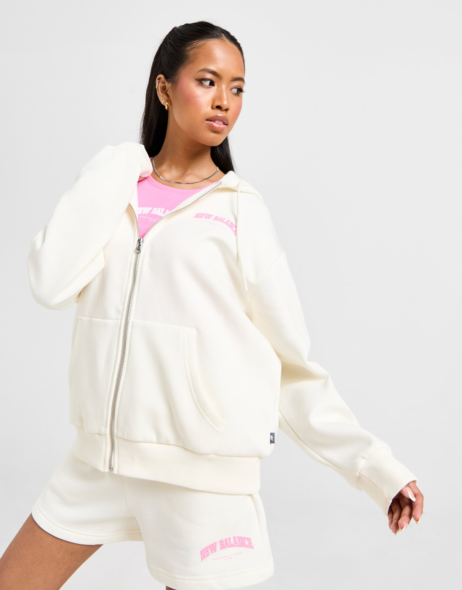 New Balance Sweat à Capuche Zippé Logo Femme