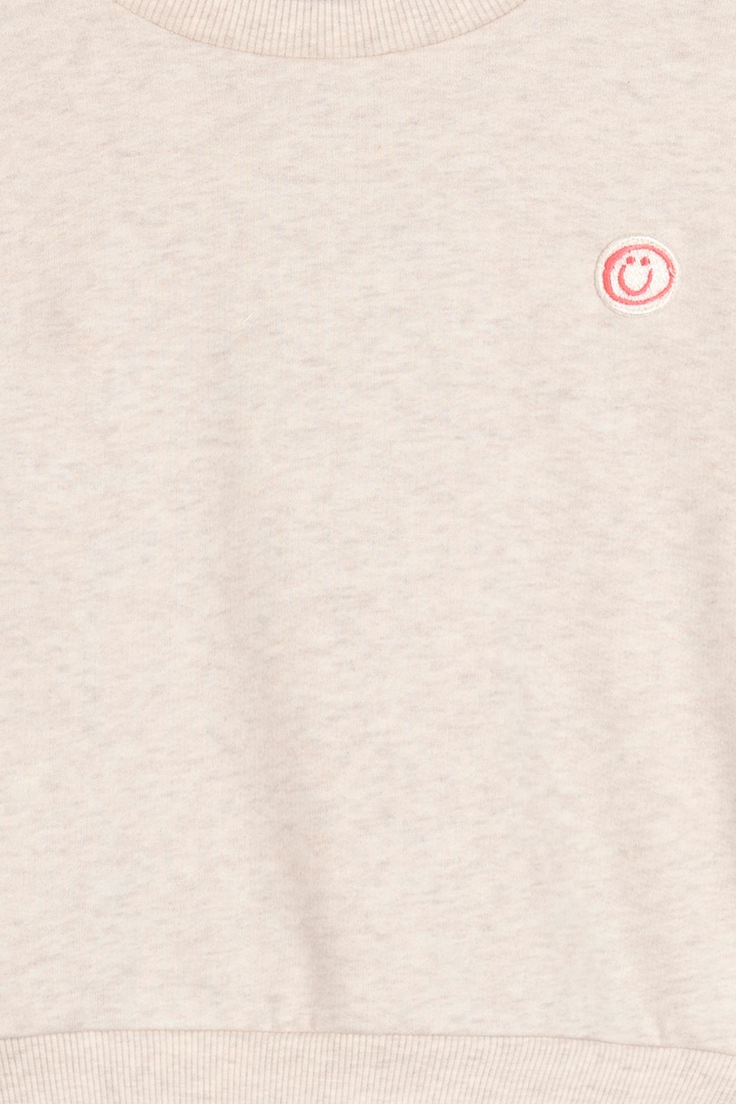 Beige sweater met smiley patch