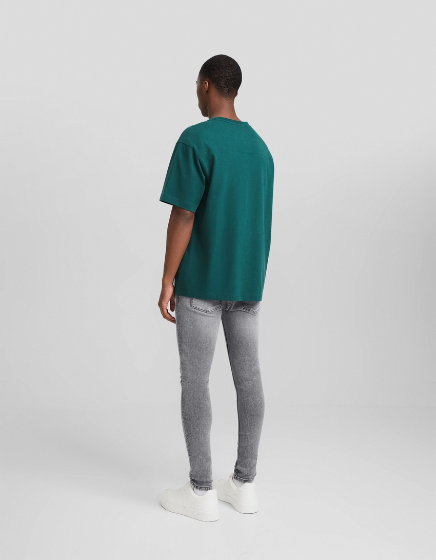 Calça jeans skinny rasgada