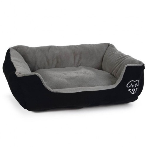 Cama de pelúcia macia para cães na cor cinza.