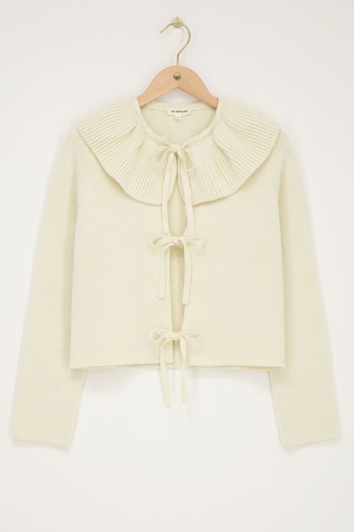 Creme gebreid vest met strikjes