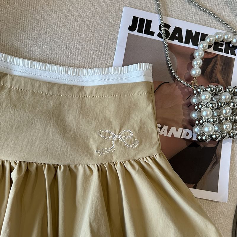 Bolgivy - Hoge taille rok met contrasterende rand en strikborduursel