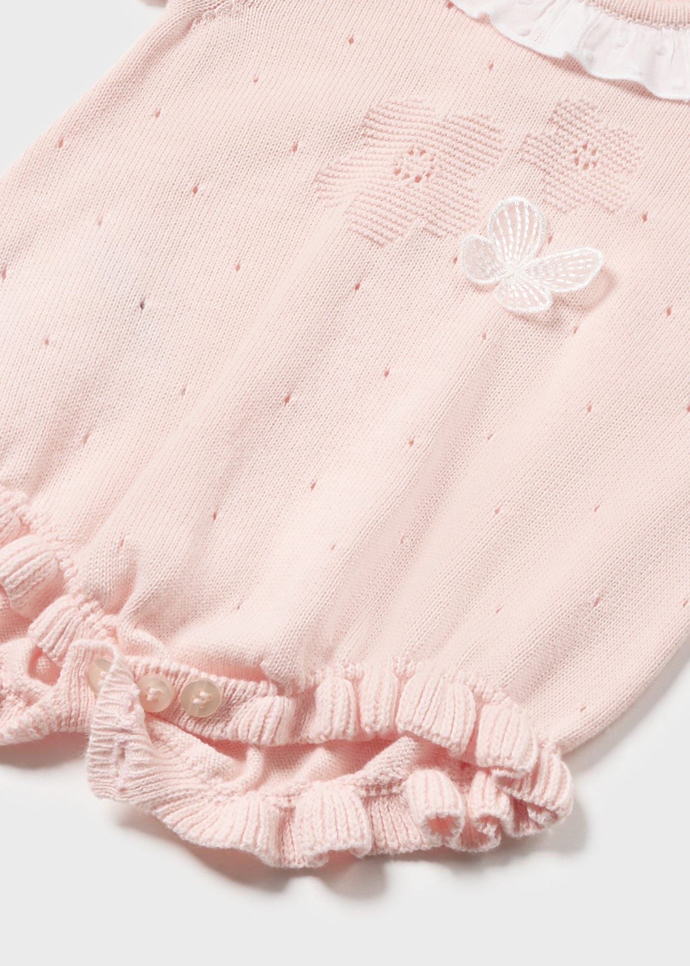 Macacão de malha Better Cotton para recém-nascidos, cor nude.