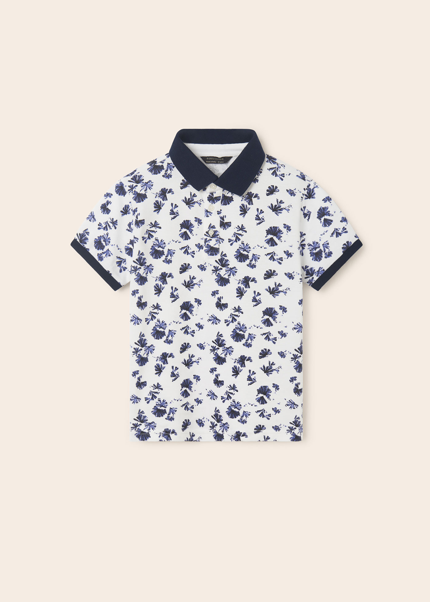 Camisa polo infantil em algodão sustentável com estampa.