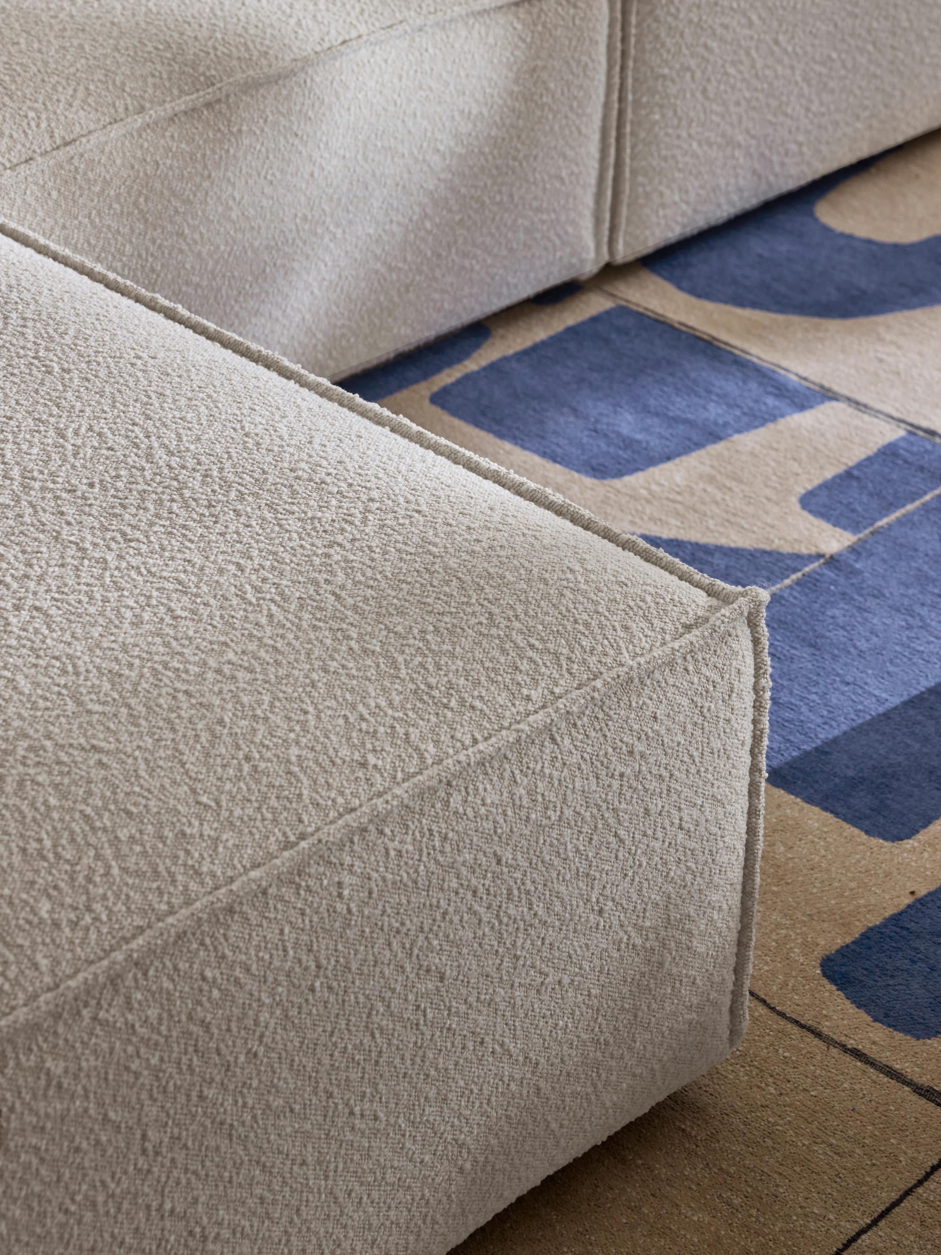 Modulaire bank Lennon (4-zits) uit bouclé met poef (links/rechts)