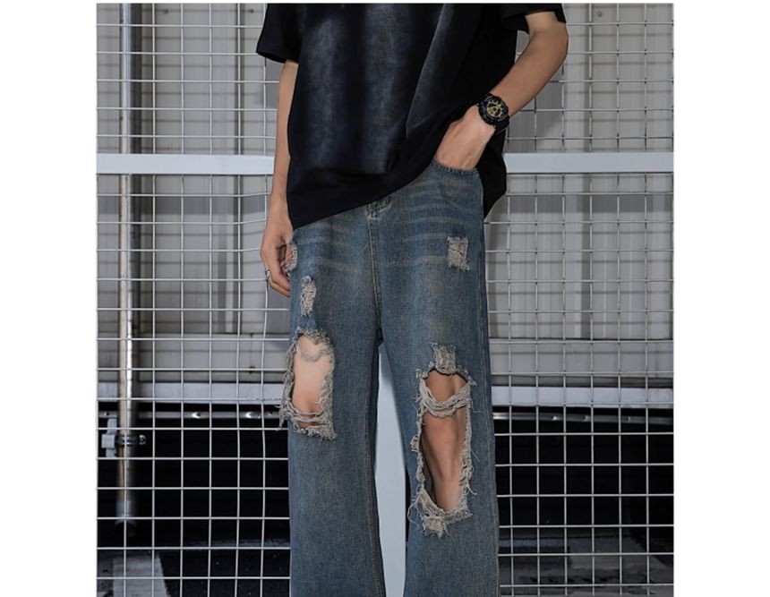 Trimecca - Hoge taille jeans met wijde pijpen en versleten look