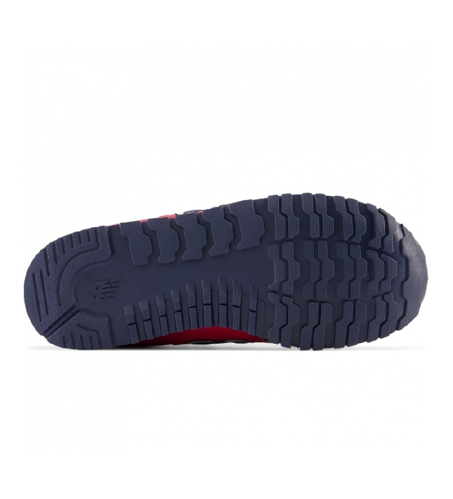 Tênis New Balance 500 com fecho de velcro, cor vermelha.