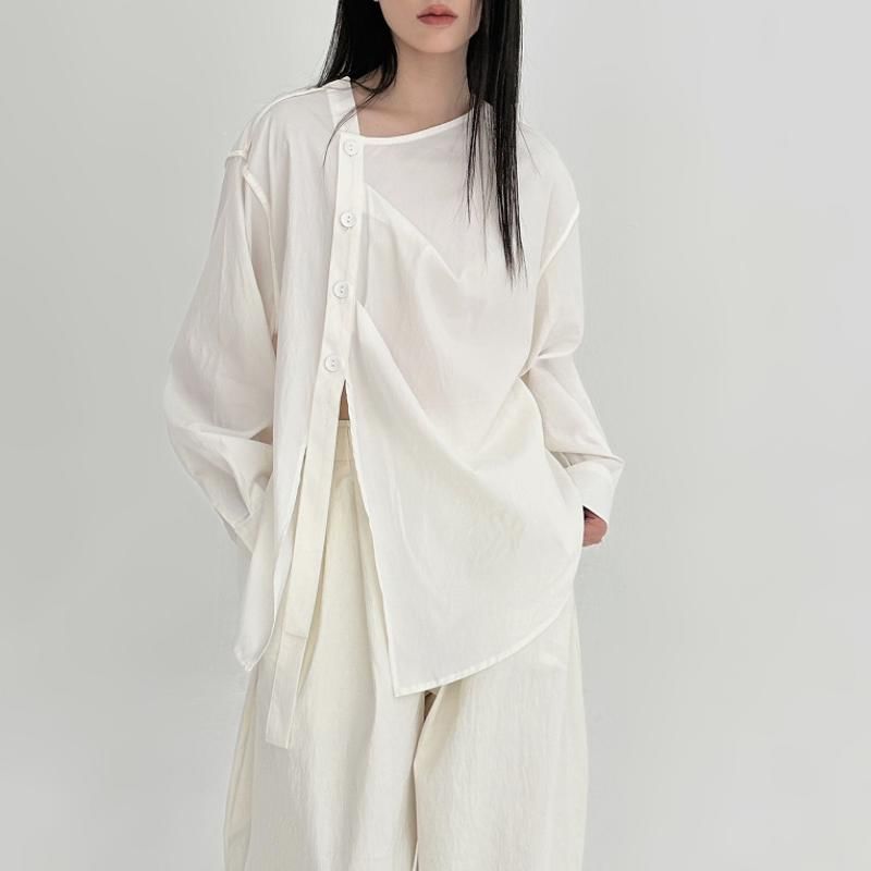 SIMPLE BLACK - Effen asymmetrische blouse
