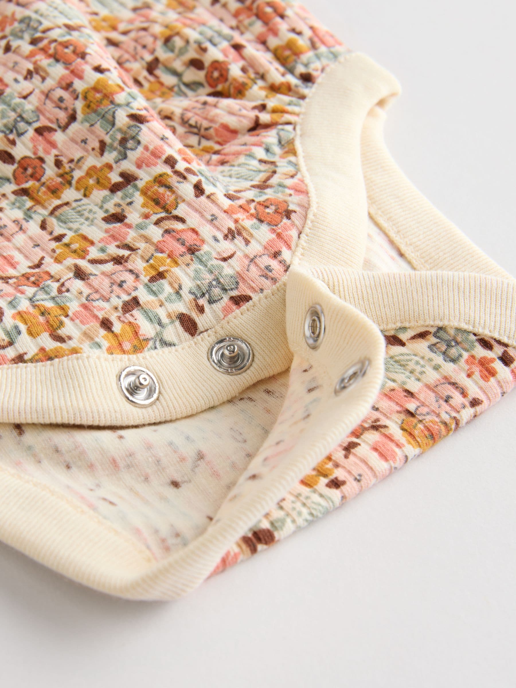 Blauw/crème/koraal Ditsy - Verpakking van 4 babyrompers met lange mouwen en ruches (0mnd-2jr)