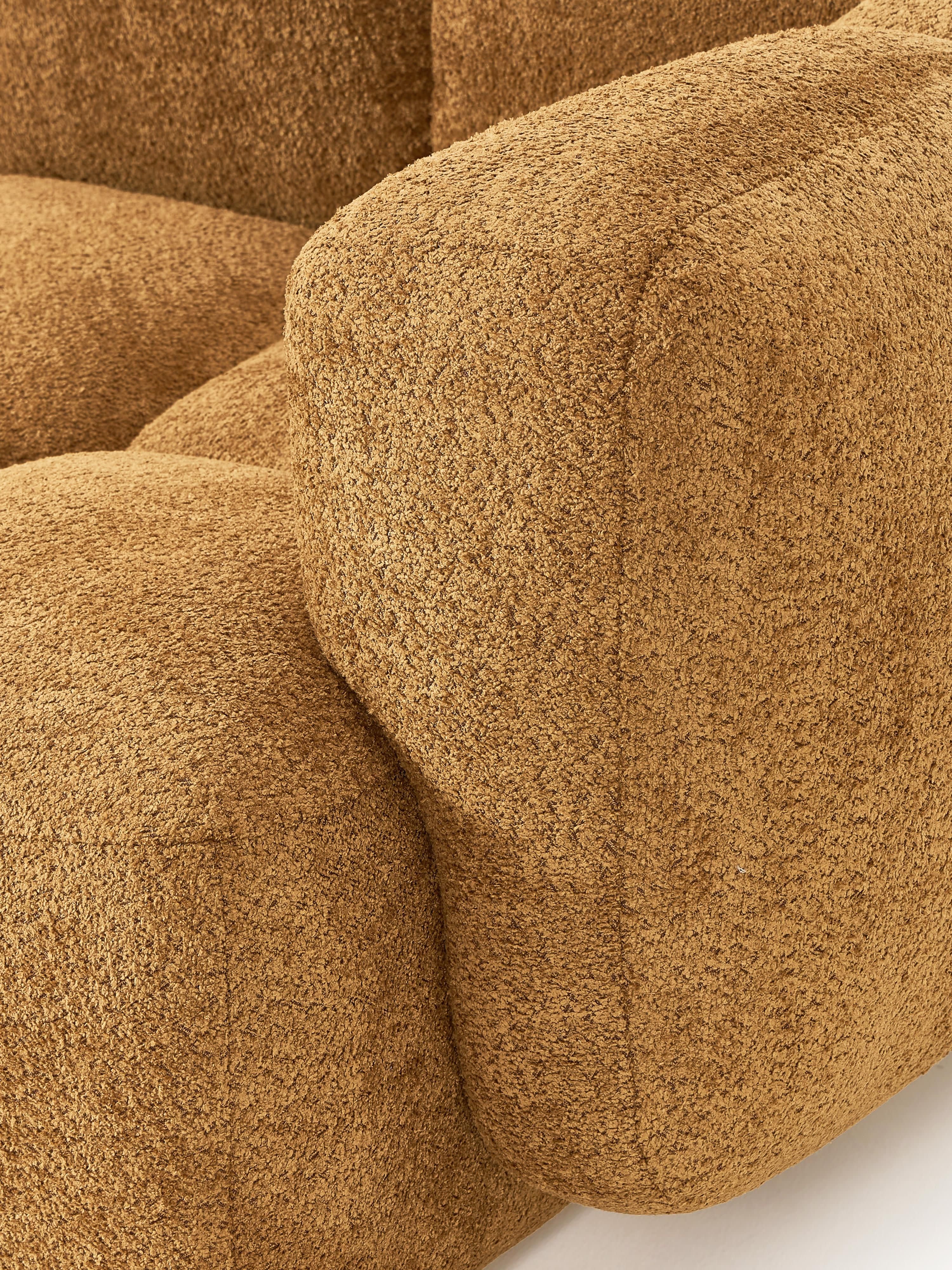 Modulaire bank Tayla (4-zits) van teddy bouclé met poef (links/rechts)
