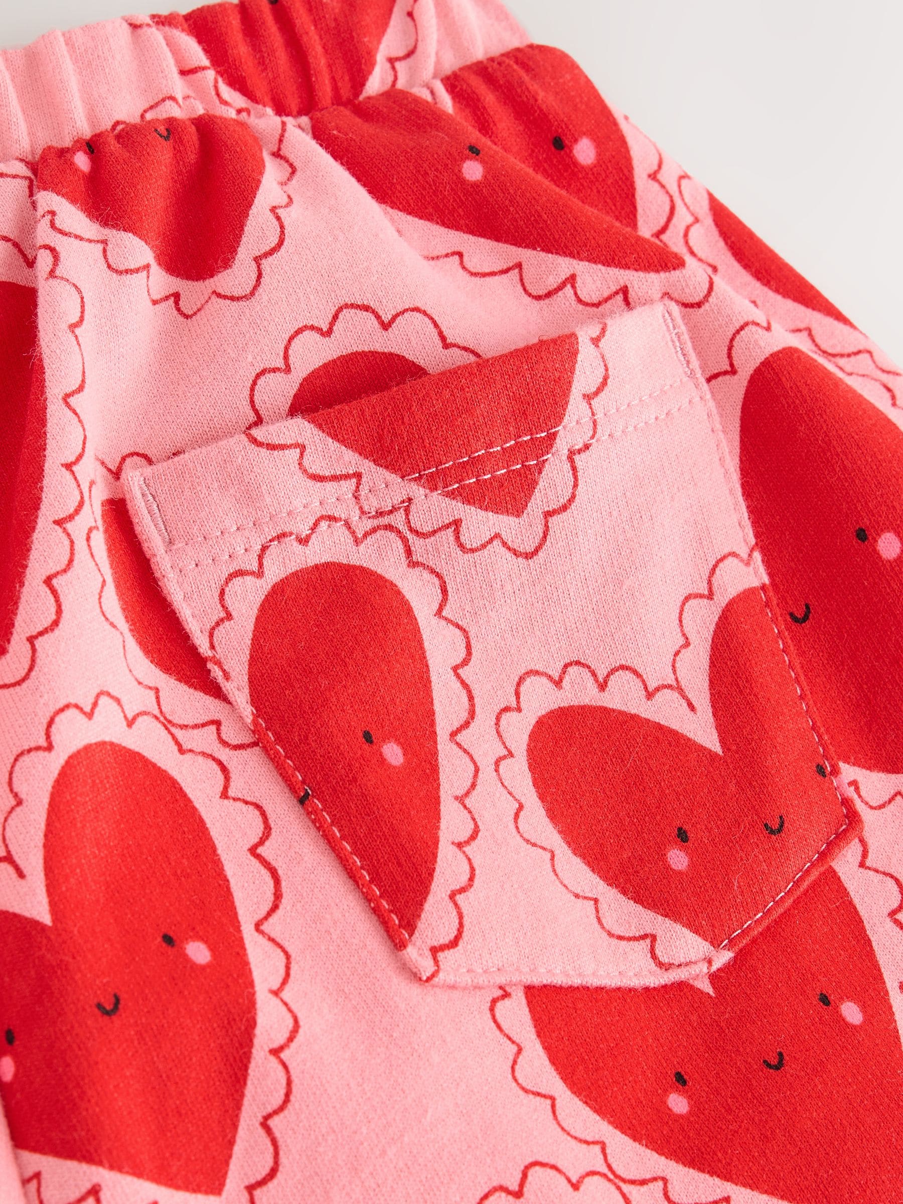 Rood met hartjesprint - Broek met structuur en wijde kortere pijpen (3mnd -7jr)