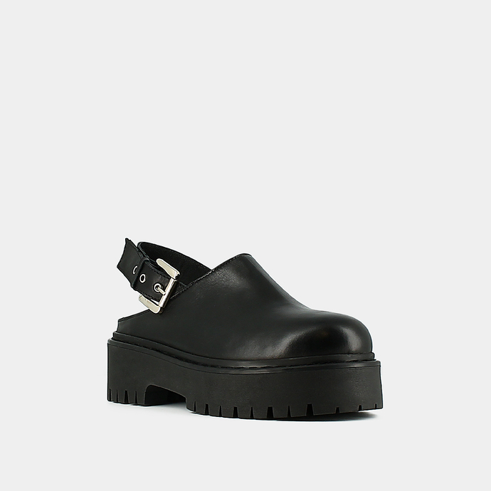 Mules à semelles crantées  en cuir noir