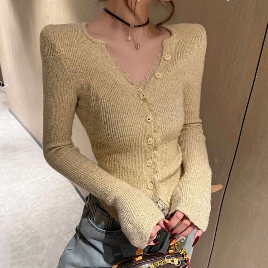 NENE - Lange mouwen V-hals effen geribbelde crop top met knoopjes
