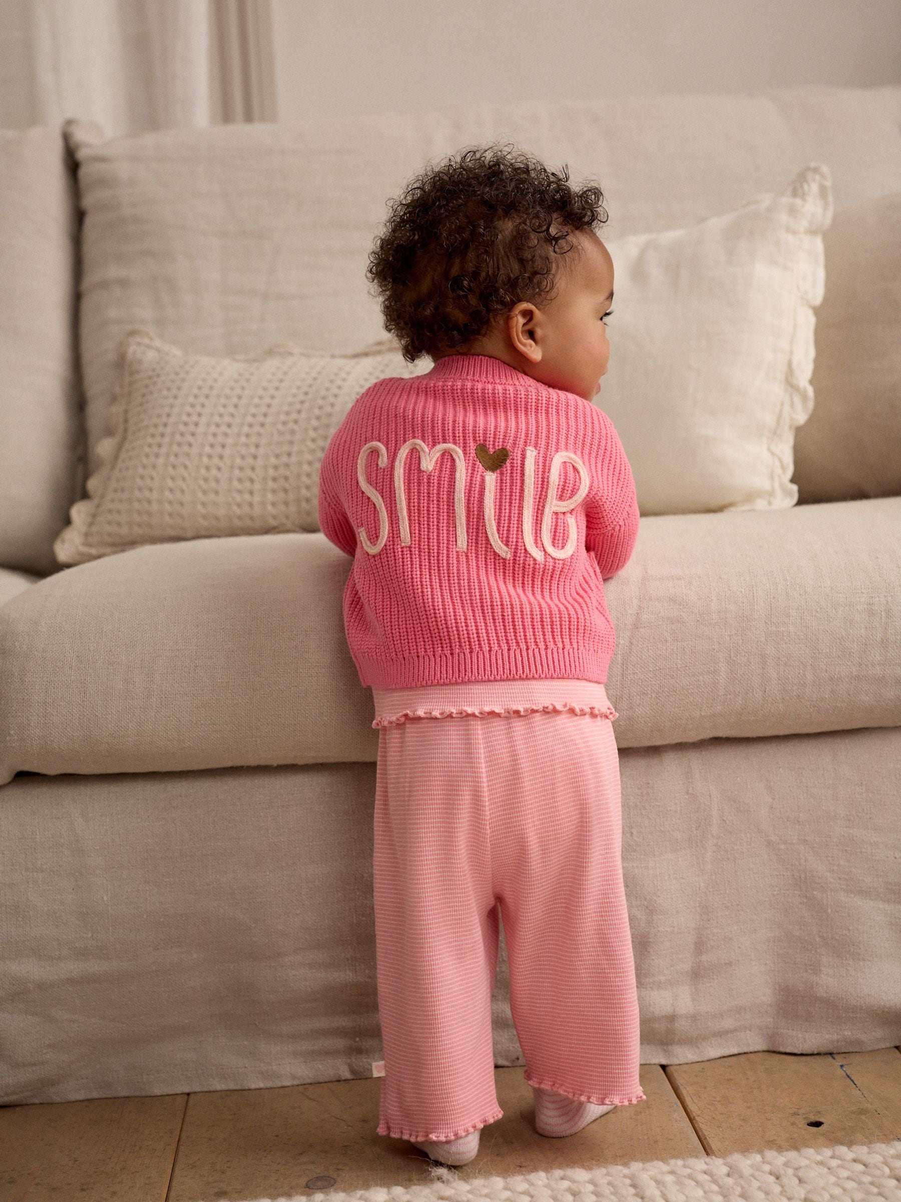 Roze met smiley - Geborduurd vest (0 mnd - 2 jr)