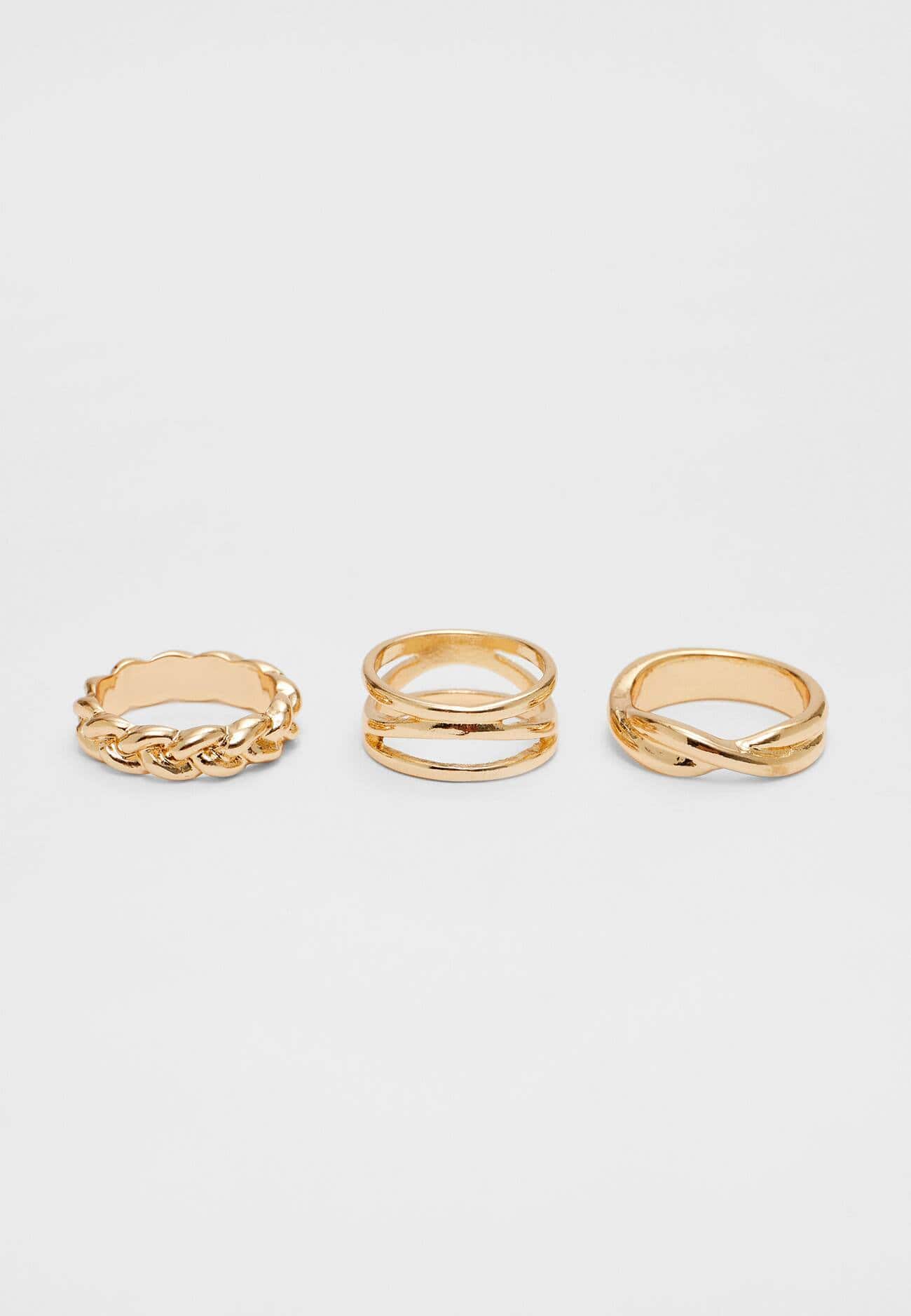 Conjunto de 7 anéis com strass e imitação de pérola.