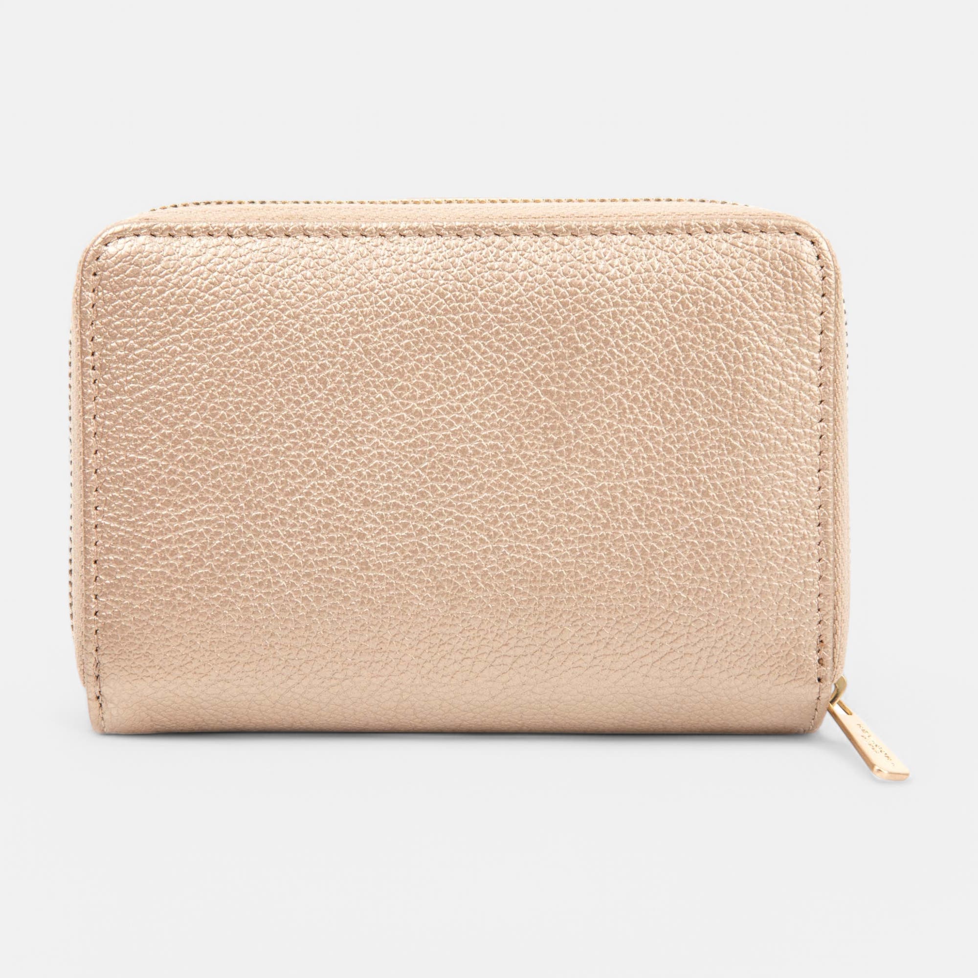 Petite maroquinerie en cuir fuchsia