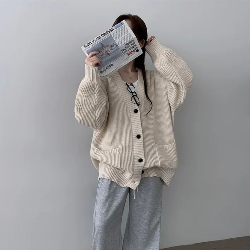 Coris - Oversized vest met pofmouwen, V-hals en effen zakdetail