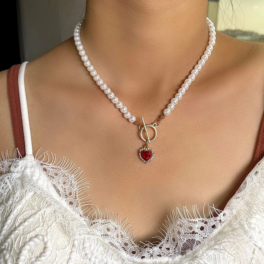 Gemsha - Kunstparelketting met strass-hartjes en hart