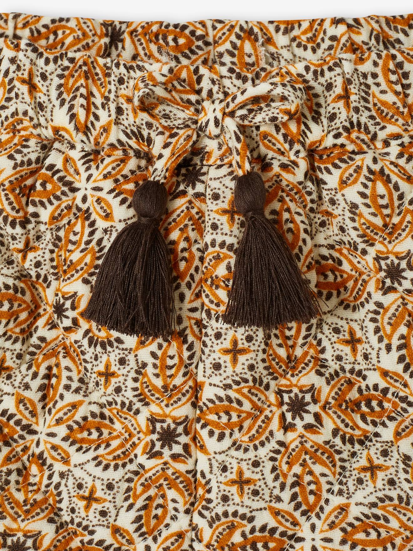 Calções estilo kilt em tom cru com estampa para meninas