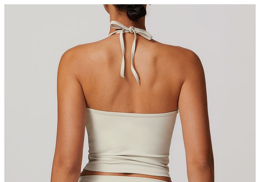 Skinniano - Haltertop met effen padding en open rug, cropped sporttop