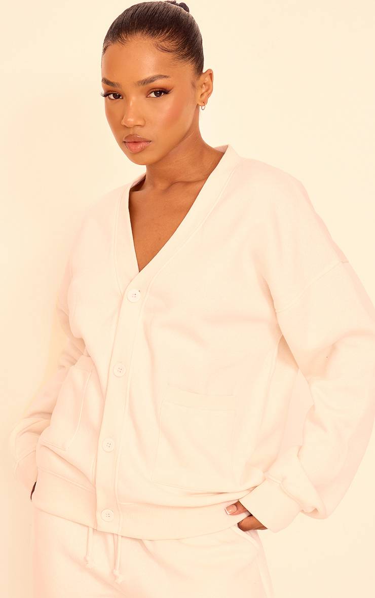 Crème Cardigan En Molleton Avec Poches Et Boutonnage Devant