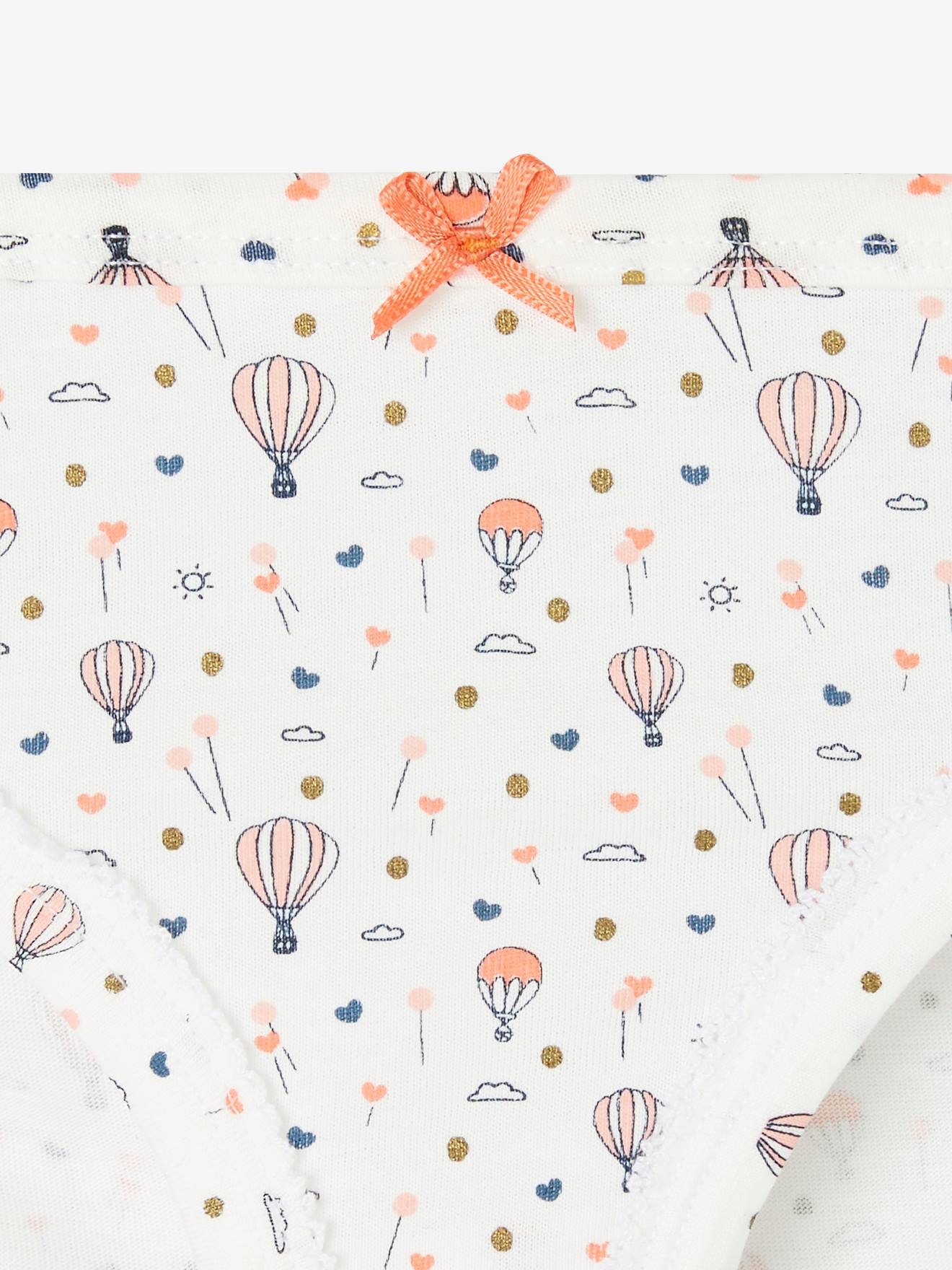 Pacote com 5 calcinhas fantasia para meninas, brancas lisas com estampas.