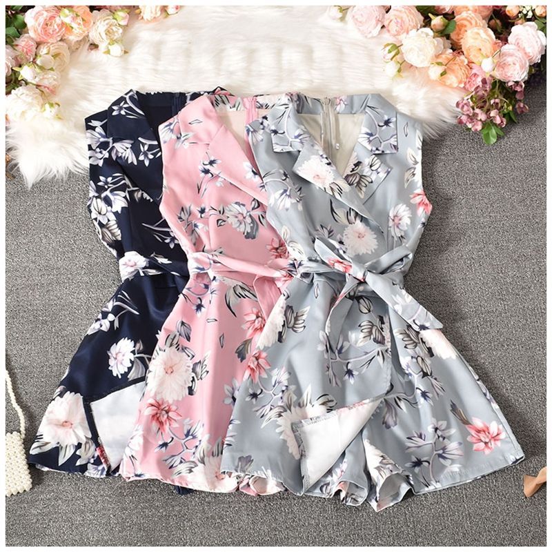 Dudu - Mouwloze romper met bloemenprint en strikceintuur
