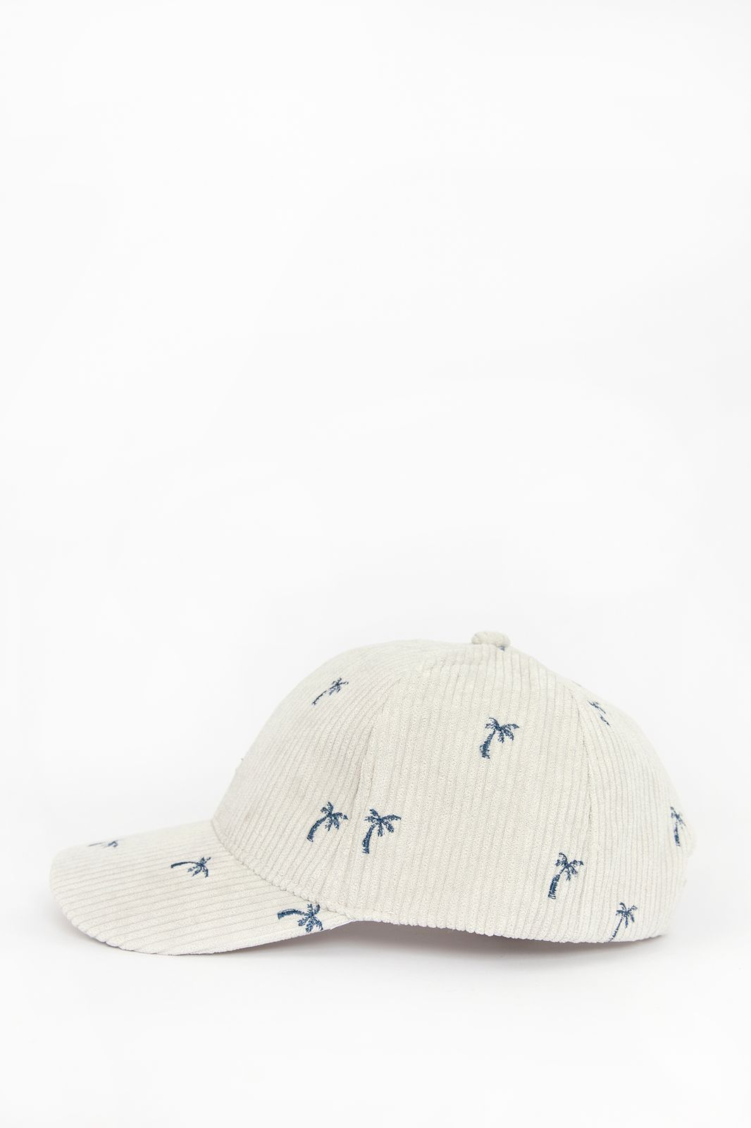 Beige corduroy pet met palmbomen