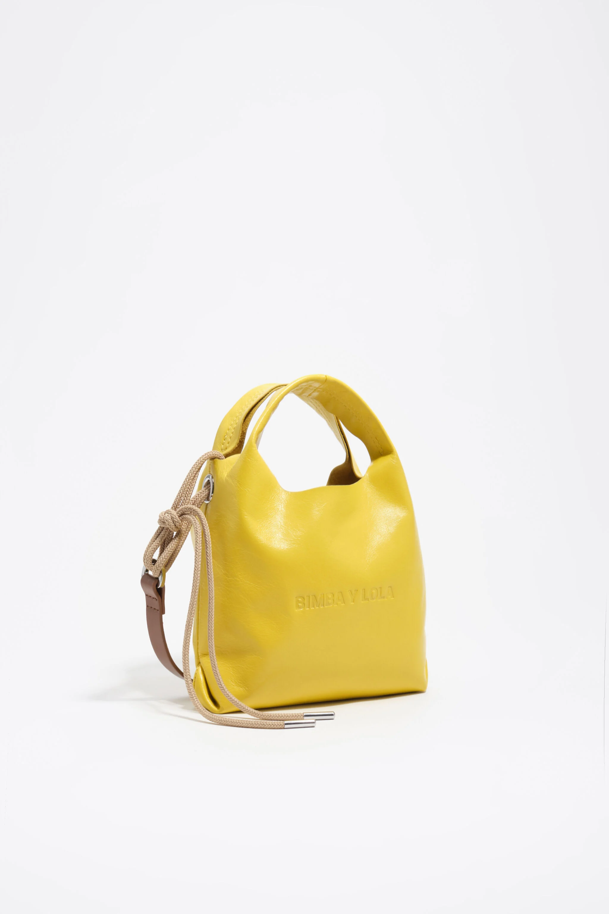 Bolsa transversal mini de couro amarelo estilo papel.