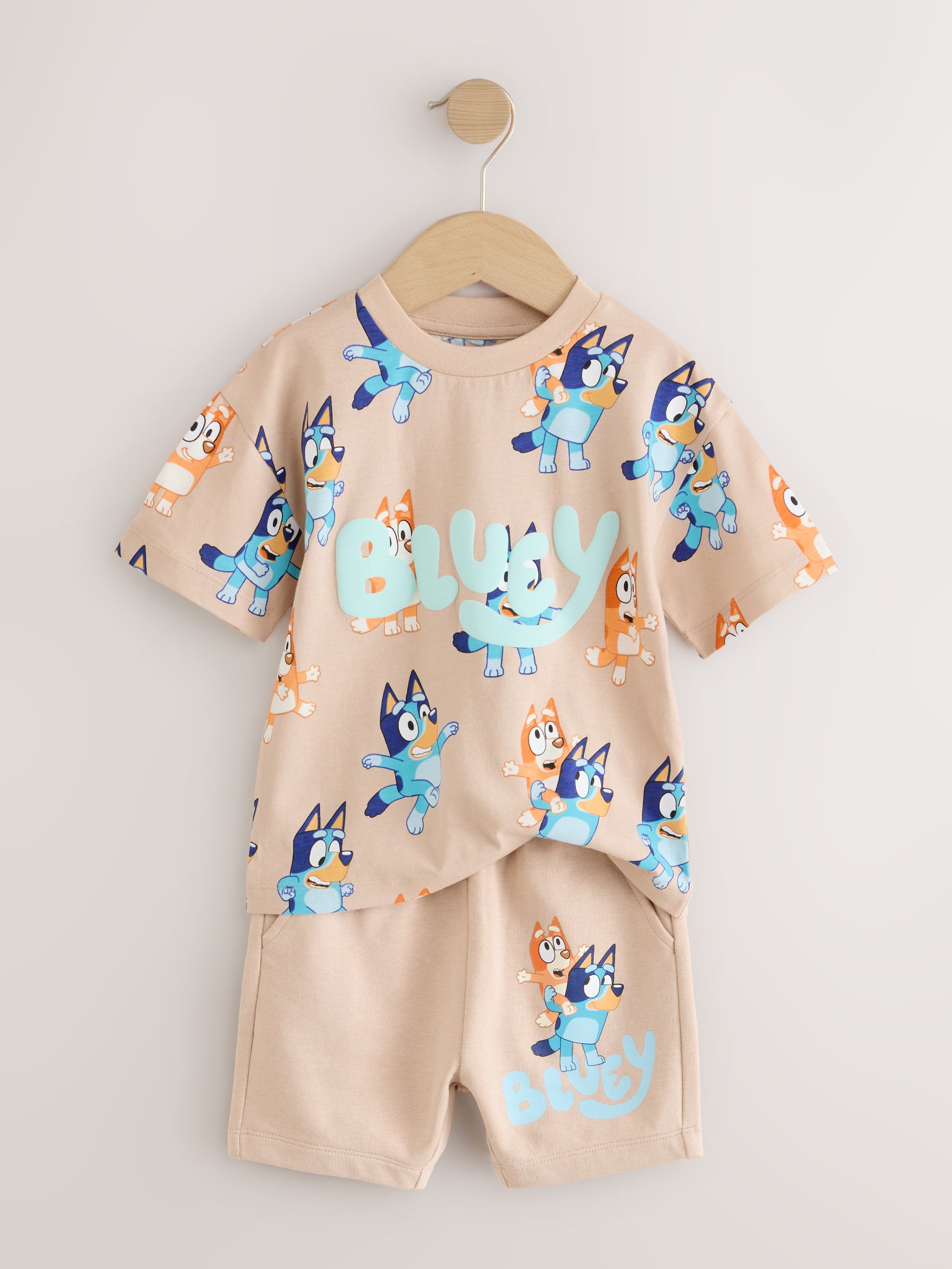 Neutraal - Set van blauw T-shirt met all-overprint en shorts met Bluey (12mnd -8jr)