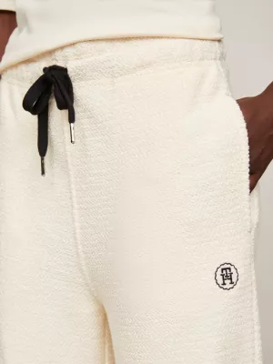 Calças de moletom afuniladas com textura e monograma TH
