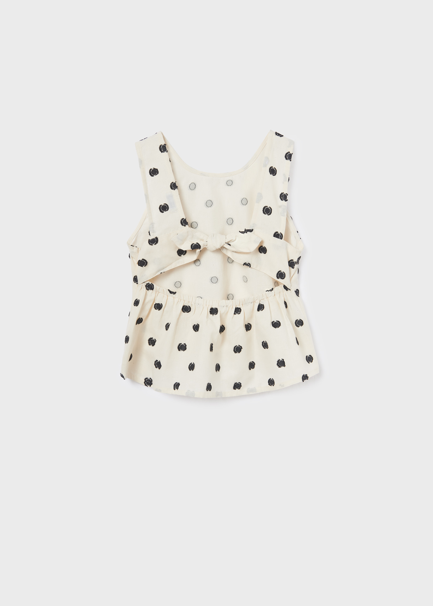 Blusa de bolinhas com laço para menina
