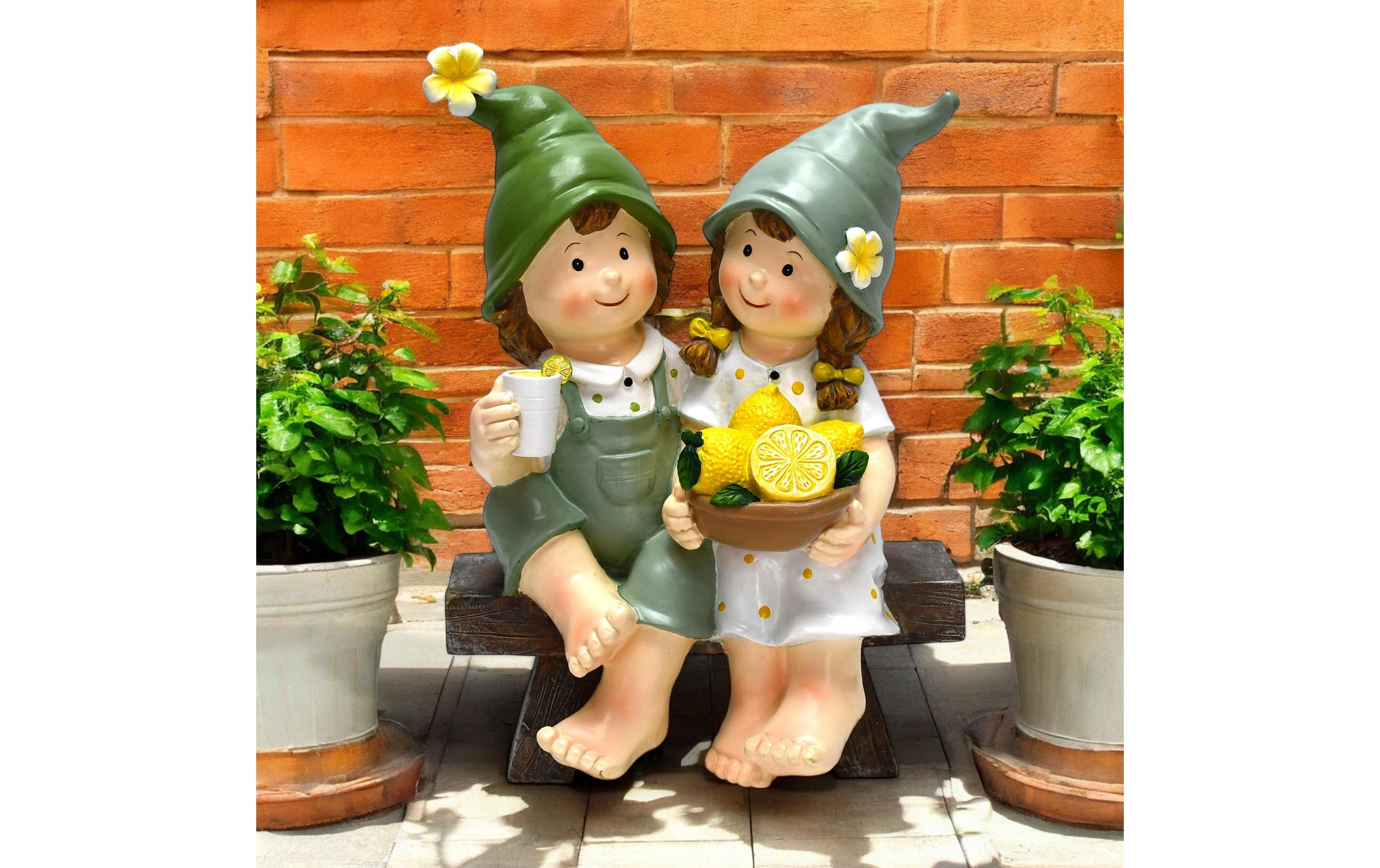 Dekofigur Kinder auf Bank sitzendGartendekoration