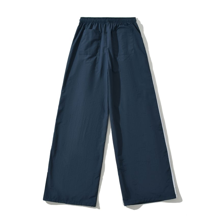Asiris - Gestreepte, losvallende joggingbroek met hoge taille en wijde pijpen